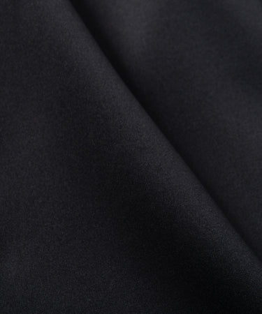 CUSTOM_ALT_TEXT: Fabric closeup on Paper Planes Basketball Short color Black.