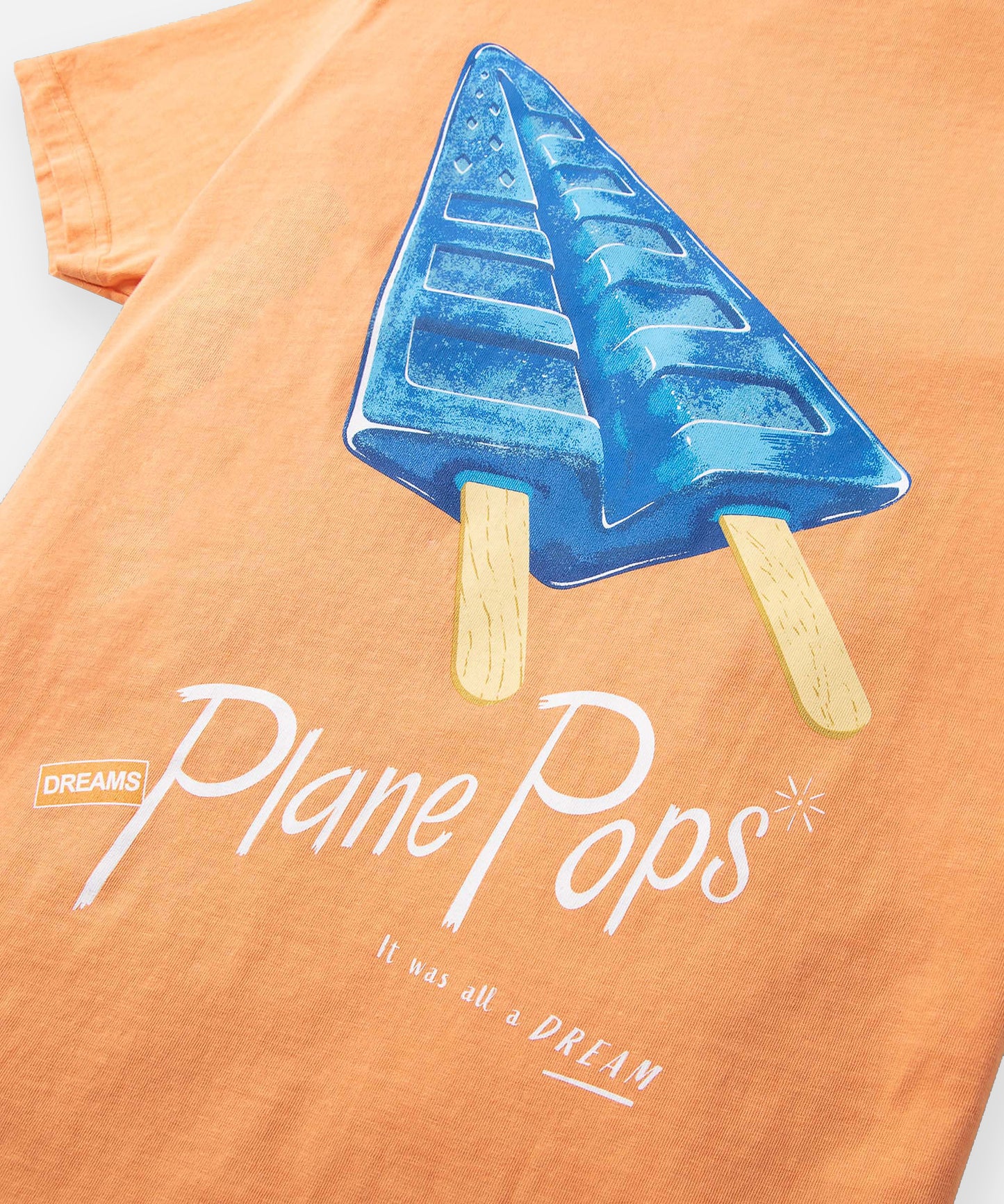 CUSTOM_ALT_TEXT: Closeup of Plane Pops print on Paper Planes Blue Raspberry Plane Pops Tee color Tangerine.