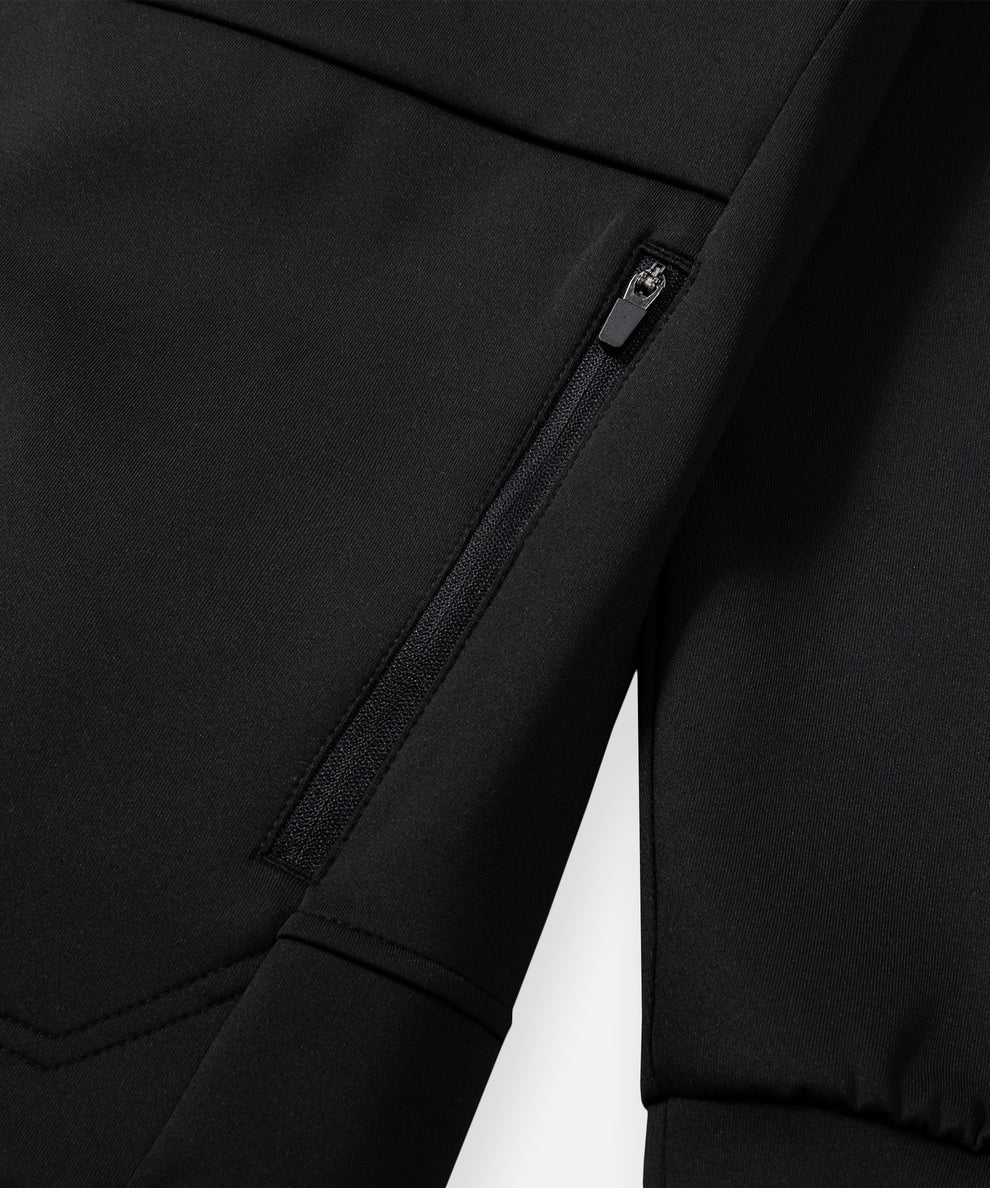 CUSTOM_ALT_TEXT: Zippered pocket detail on Paper Planes Greatness Is a Process Zip-Up Hoodie, color Black.
