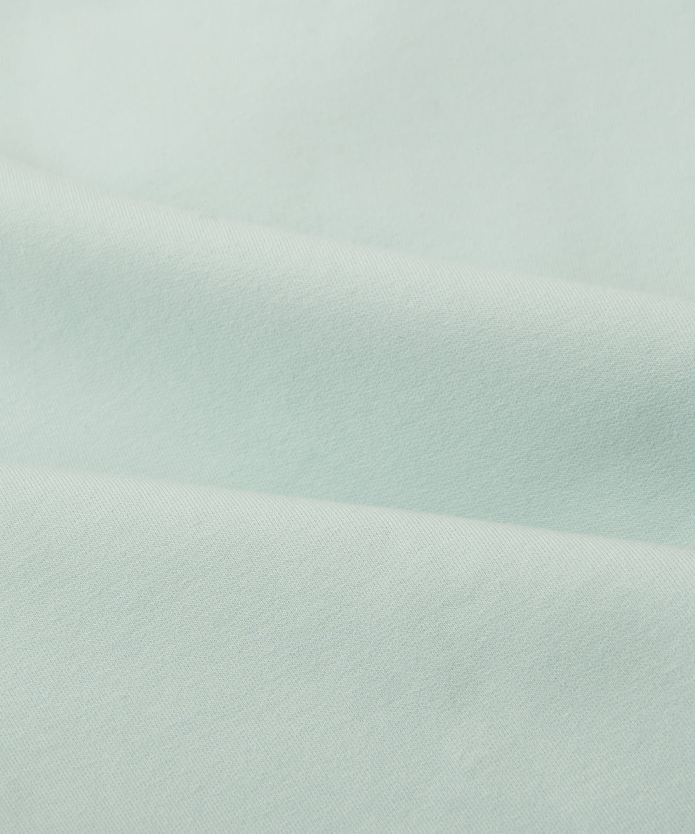CUSTOM_ALT_TEXT: Fabric closeup on Paper Planes Chromatic Crewneck Sweatshirt color Powder Blue.