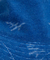 CUSTOM_ALT_TEXT: Fabric closeup of Paper Planes Jacquard Terry Cloth Bucket Hat color Nautical Blue.