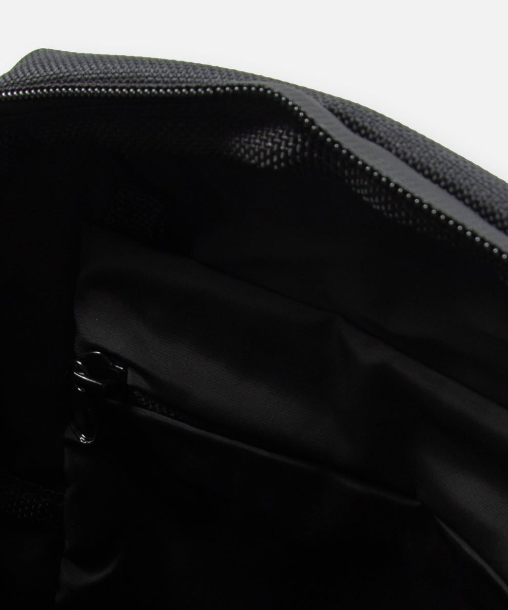 CUSTOM_ALT_TEXT: Interior compartment view of Paper Planes Quilted Sling Bag.