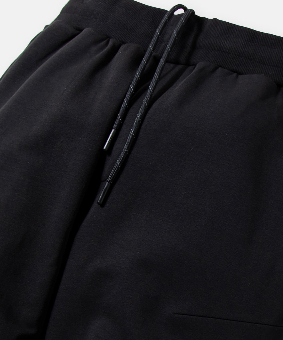 CUSTOM_ALT_TEXT: Encased elastic waistband with interior exit drawcord on Paper Planes Solid Jogger, color Black.